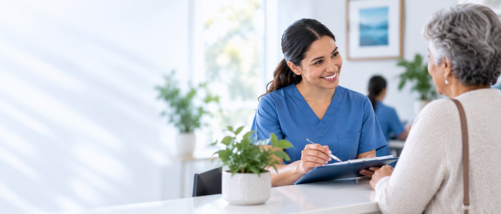 Welcoming healthcare professional speaking with an older adult in a bright clinical setting